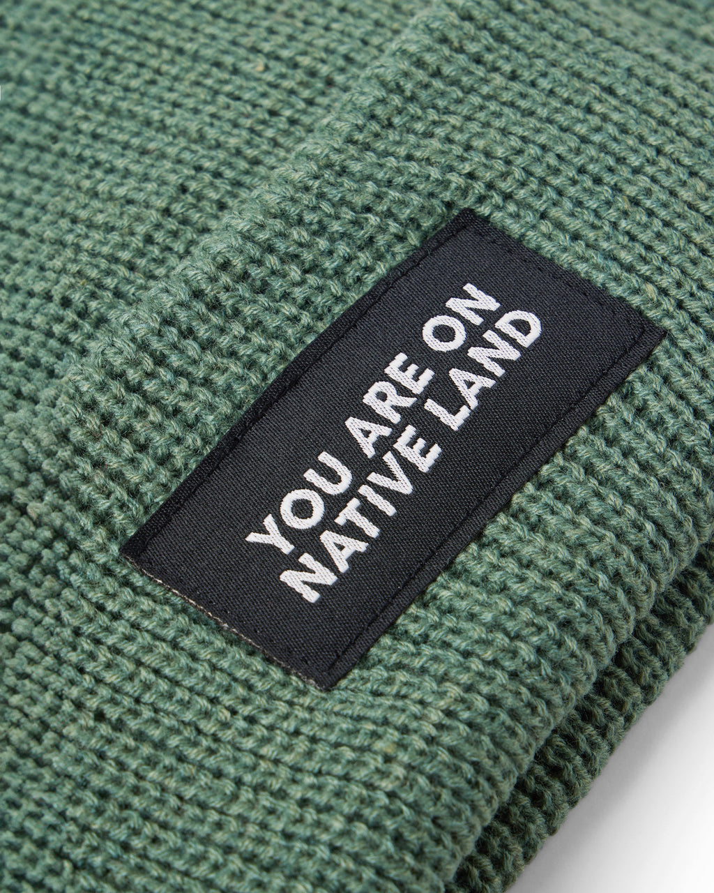 'YOU ARE ON NATIVE LAND' RIBBED BEANIE